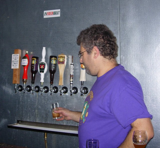 Alan standing by the taps.