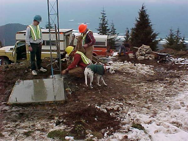 Finishing the concrete slab for building base.